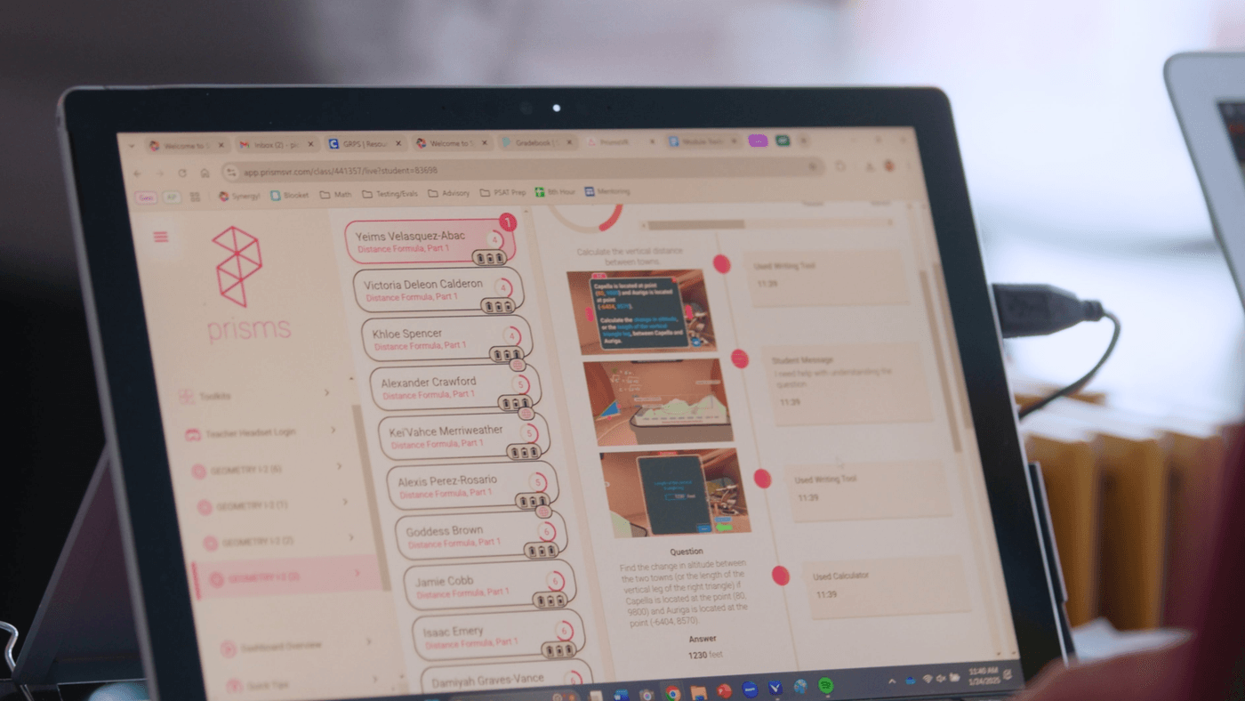 A digital classroom dashboard on a laptop screen displays a list of student names and their progress on "Distance Formula, Part 1" alongside a math problem about calculating the vertical distance between two towns, Capella and Auriga.